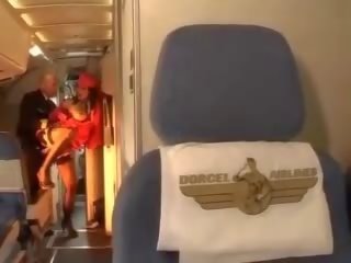 Libidinous stewardess rides a member inside both holes
